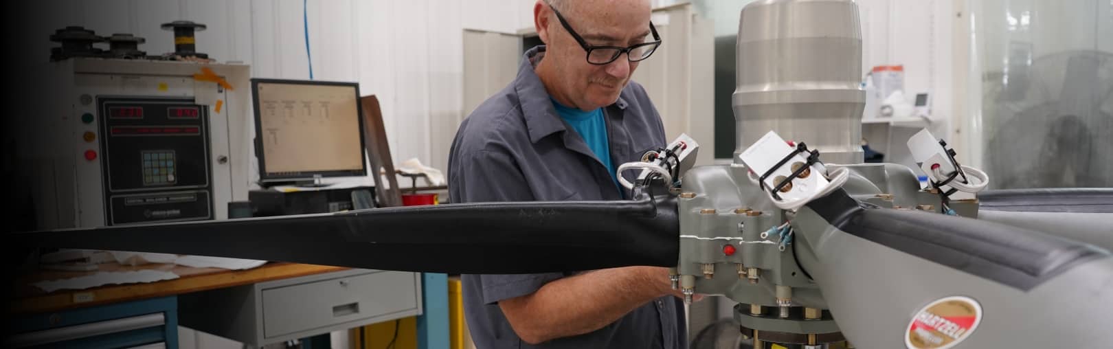 Closeup of Hartzell technician adjusting Hartzell Propeller